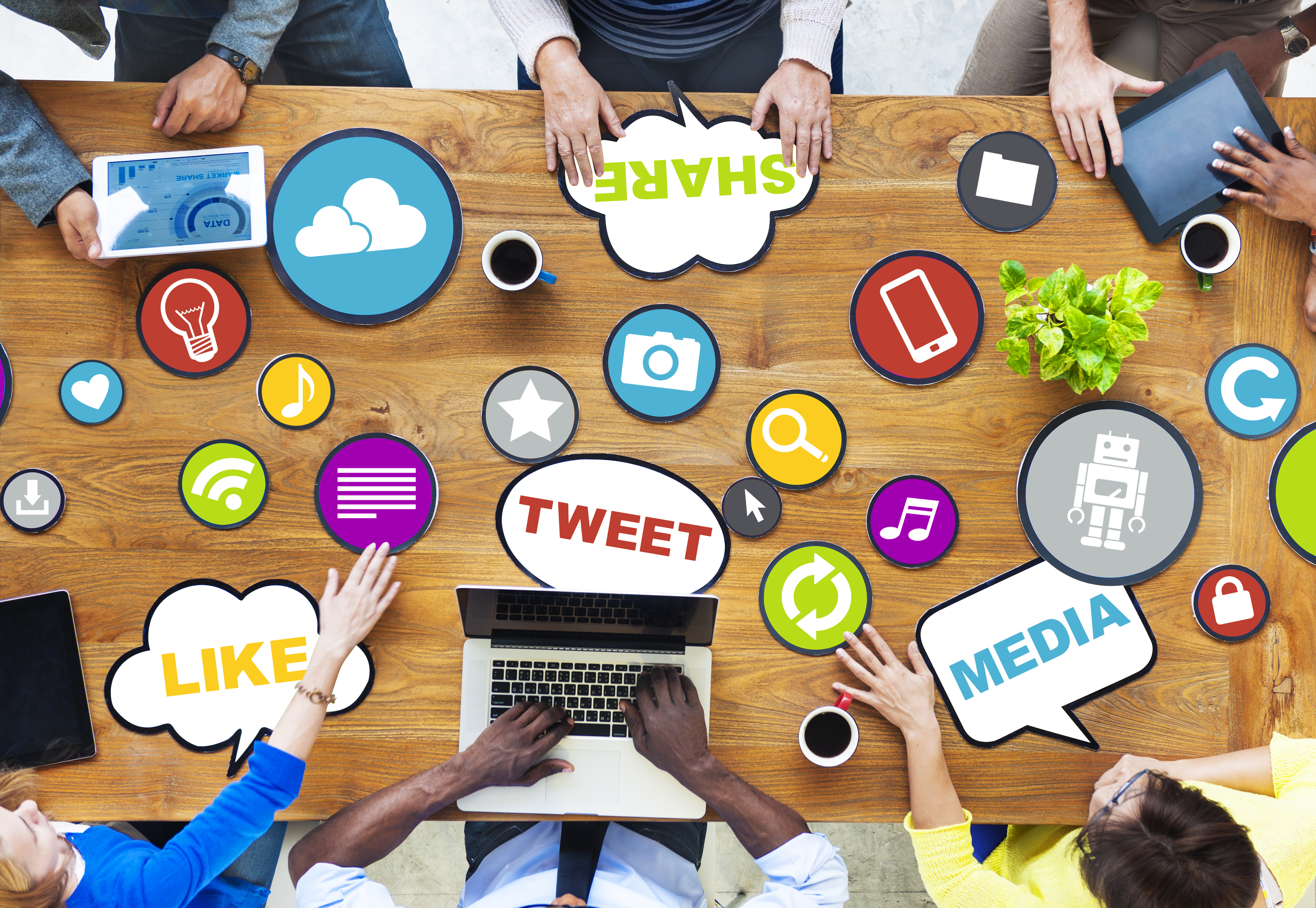 A team working on social media startegies around a table